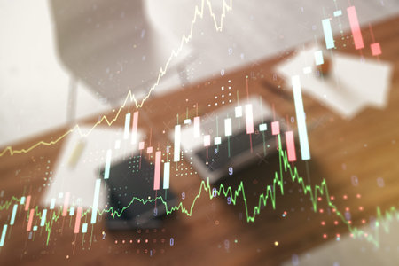 Double exposure of abstract creative financial chart and modern desktop with laptop on background,...