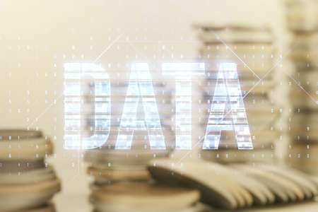 Data word hologram on growing coins stacks background, big data and blockchain concept. Multiexposureの写真素材
