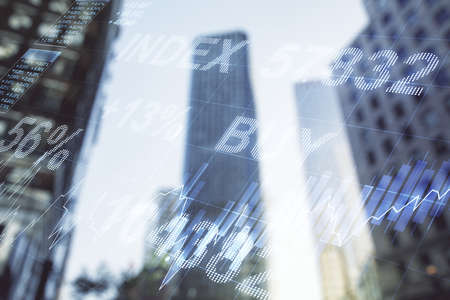 Multi exposure of abstract financial diagram on office buildings background, banking and accounting conceptの写真素材