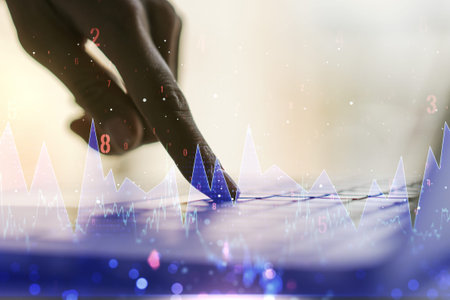 Double exposure of abstract creative statistics data hologram with hands typing on laptop on background, statistics and analytics conceptの写真素材