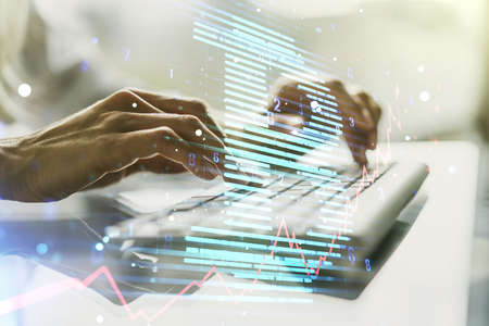 Creative Bitcoin concept with hands typing on laptop on background. Multiexposureの写真素材