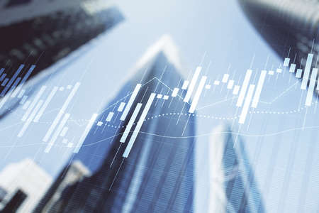 Double exposure of abstract financial graph on office buildings background, financial and trading conceptの写真素材