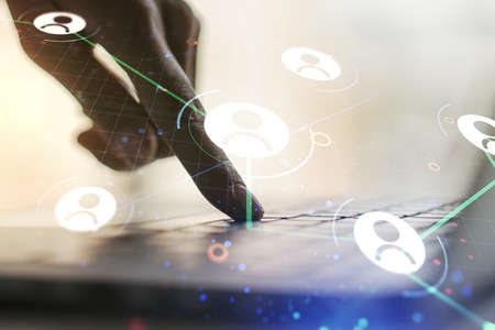 Social network concept with hands typing on laptop on background. Multiexposureの写真素材