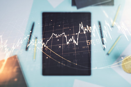 Multi exposure of abstract financial diagram and modern digital tablet on background, banking and...