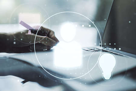 Social network media concept with hand writing in diary on background with laptop. Double exposureの写真素材