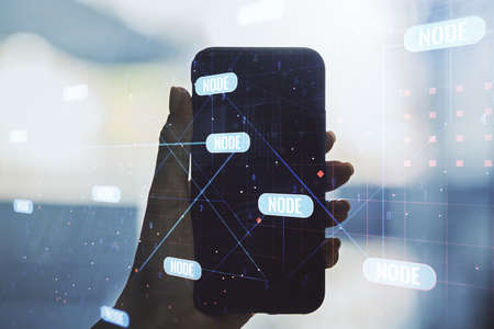 Double exposure of abstract programming language hologram and hand with cell phone on background, research and development conceptの写真素材