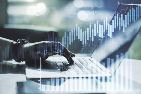 Multi exposure of abstract financial graph with hand typing on laptop on background, financial and...