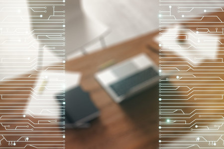Double exposure of circuit hologram and modern desktop with laptop on background. Research and...