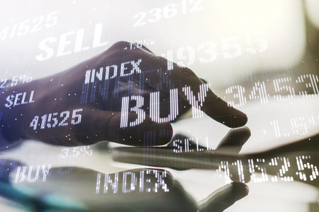 Double exposure of abstract creative financial chart with finger clicks on a digital tablet on...