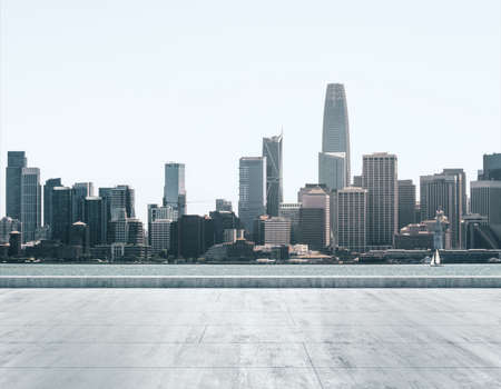 Empty concrete dirty seafront on the background of a beautiful San Francisco city skyline at daytime, mock upの写真素材