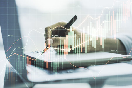 Abstract creative financial graph with hand writing in notebook on background, forex and investment...