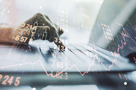 Multi exposure of stats data illustration with hands typing on computer keyboard on background, computing and analytics conceptの写真素材