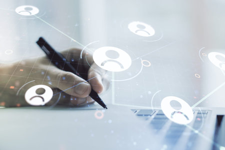 Double exposure of social network icons concept with hand writing in notepad on background with...