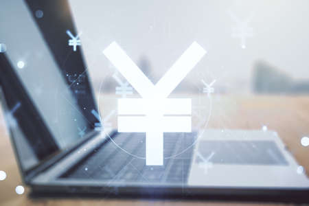 Double exposure of creative Japanese Yen symbol hologram on laptop background. Banking and investing conceptの写真素材