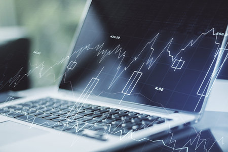 Double exposure of abstract creative financial chart on modern laptop background, research and...
