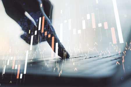 Multi exposure of abstract financial graph with world map and with hand typing on laptop on...