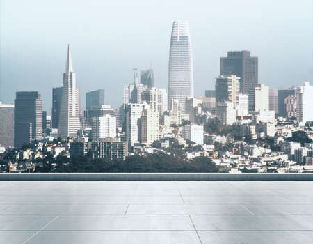 Empty concrete rooftop on the background of a beautiful San Francisco city skyline at sunset, mock upの写真素材