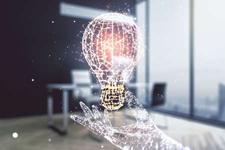Creative light bulb illustration and modern desktop with pc on background, future technology concept. Multiexposureの写真素材