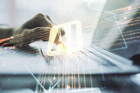 Double exposure of creative artificial Intelligence icon with hands typing on laptop on background. Neural networks and machine learning conceptの写真素材