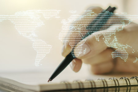 Abstract creative digital world map and woman hand writing in diary on background, globalization concept. Multiexposureの写真素材
