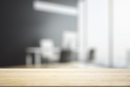 Empty office wooden table with empty space on modern workplace with computer background, close up,...