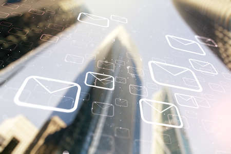 Abstract virtual postal envelopes hologram on modern architecture background, email and notification concept. Multiexposureの写真素材