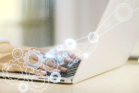 Creative abstract robotics technology sketch and hands typing on computer keyboard on background, future technology and AI concept. Double exposureの写真素材