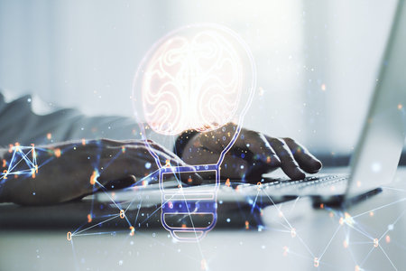 Creative light bulb with human brain hologram and with hands typing on computer keyboard on background, artificial Intelligence and neural networks concept. Multiexposureの写真素材