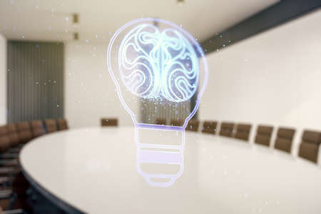 Double exposure of abstract virtual creative light bulb hologram with human brain on a modern meeting room background, idea and brainstorming conceptの写真素材