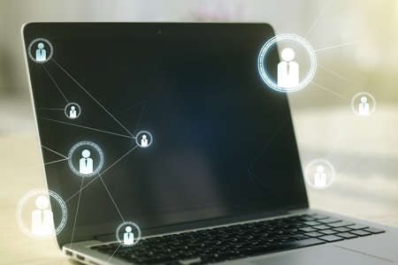 Double exposure of social network icons concept with modern laptop on background. Marketing and promotion conceptの写真素材