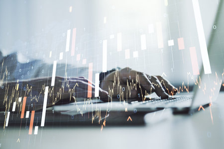 Abstract creative financial graph with world map and hands typing on laptop on background, financial...