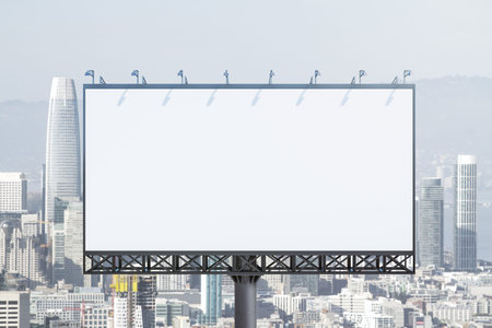 Blank white billboard on cityscape background at daytime, front view. Mock up, advertising conceptの写真素材