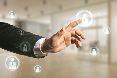 Double exposure of businessman hand working with social network icons on blurred office background....