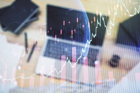 Abstract creative financial graph with world map on modern laptop background, forex and investment...