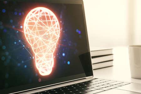 Modern computer monitor with creative light bulb hologram, research and development concept. 3D Renderingの写真素材