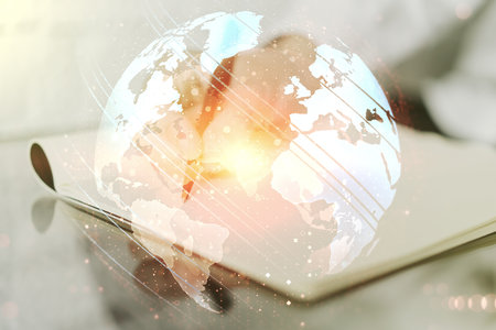 Multi exposure of abstract graphic world map and man hand writing in notepad on background, connection and communication conceptの写真素材