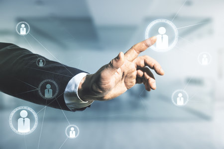 Double exposure of man hand presses on abstract virtual social network icons on blurred office background. Marketing and promotion conceptの写真素材
