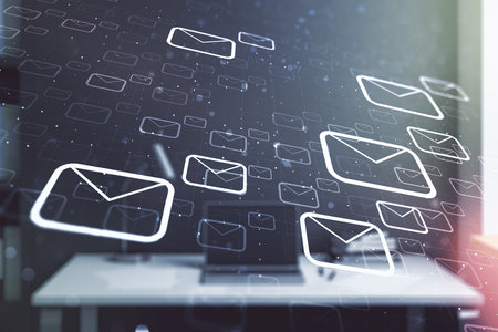 Creative abstract postal envelopes hologram and modern desktop with pc on background, email and notification concept. Multiexposureの写真素材