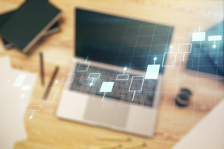 Double exposure of abstract creative financial chart on modern laptop background, research and strategy conceptの写真素材