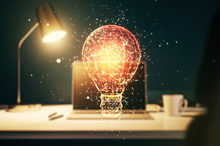 Double exposure of creative light bulb hologram on laptop background, research and development conceptの写真素材