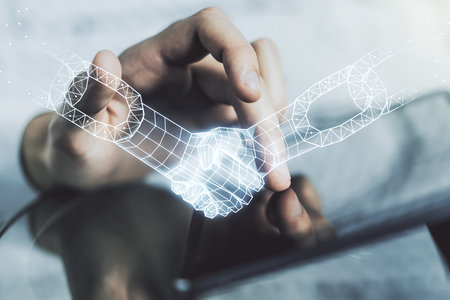 Creative concept of blockchain technology with handshake and finger clicks on a digital tablet on background. digital money transfers and decentralization concept. Multiexposureの写真素材