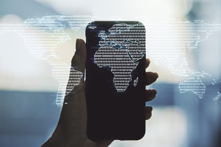 Double exposure of abstract digital world map and hand with cellphone on background, big data and...