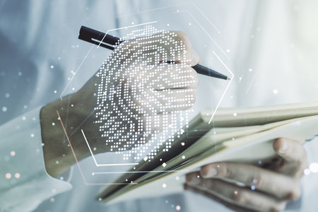 Abstract creative fingerprint concept with man hand writing in notebook on background. Multiexposureの写真素材