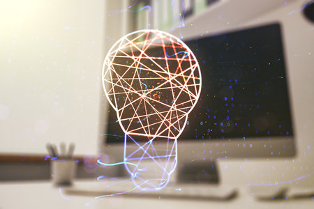 Creative light bulb illustration and modern desktop with pc on background, future technology concept. Multiexposureの写真素材