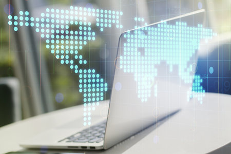 Multi exposure of abstract creative digital world map on modern laptop background, tourism and traveling conceptの写真素材