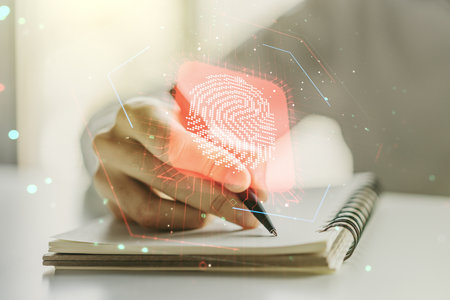 Double exposure of abstract creative fingerprint hologram with man hand writing in notebook on background, research and development conceptの写真素材