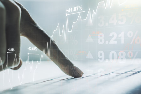 Multi exposure of abstract financial diagram with hand typing on computer keyboard on background, banking and accounting conceptの写真素材