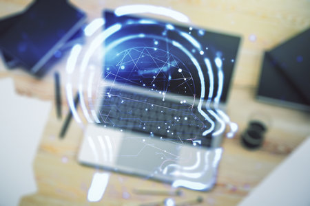Creative artificial Intelligence concept with human head hologram on modern laptop background. Multiexposureの写真素材