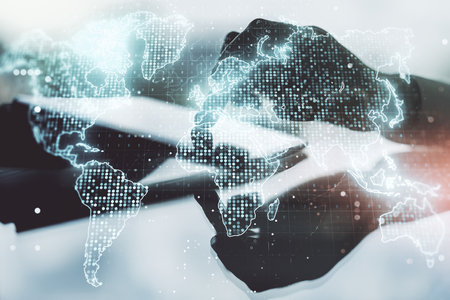 Abstract creative world map and finger clicks on a digital tablet on background, international trading concept. Multiexposureの写真素材