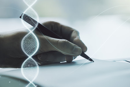 Double exposure of creative DNA hologram and man hand writing in notebook on background. Bio Engineering and DNA Research conceptの写真素材